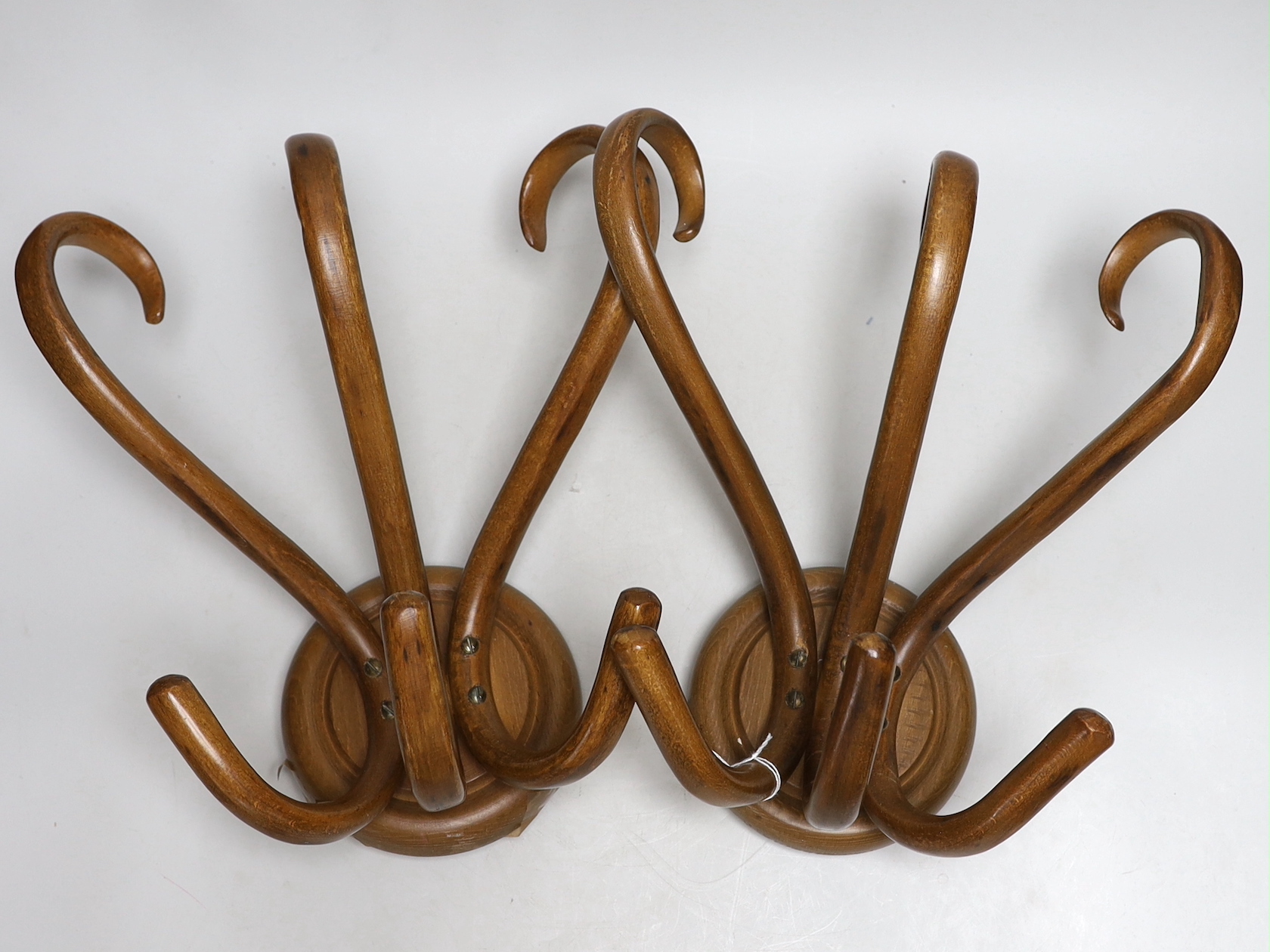 A pair of Thonet bentwood hanging coat hangers, 24cm high, 29cm high